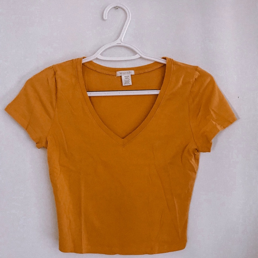 yellow colored cropped T shirt